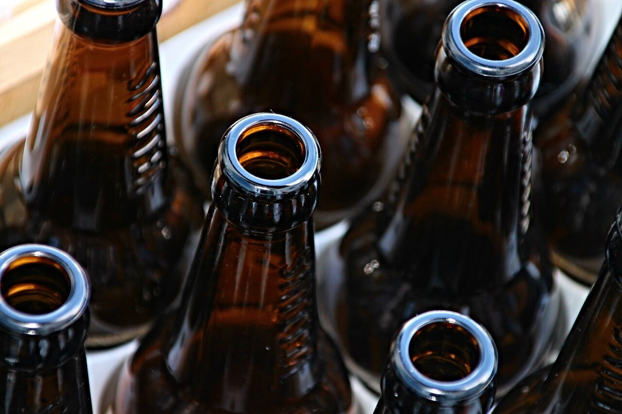 Glass bottles in recycling bin